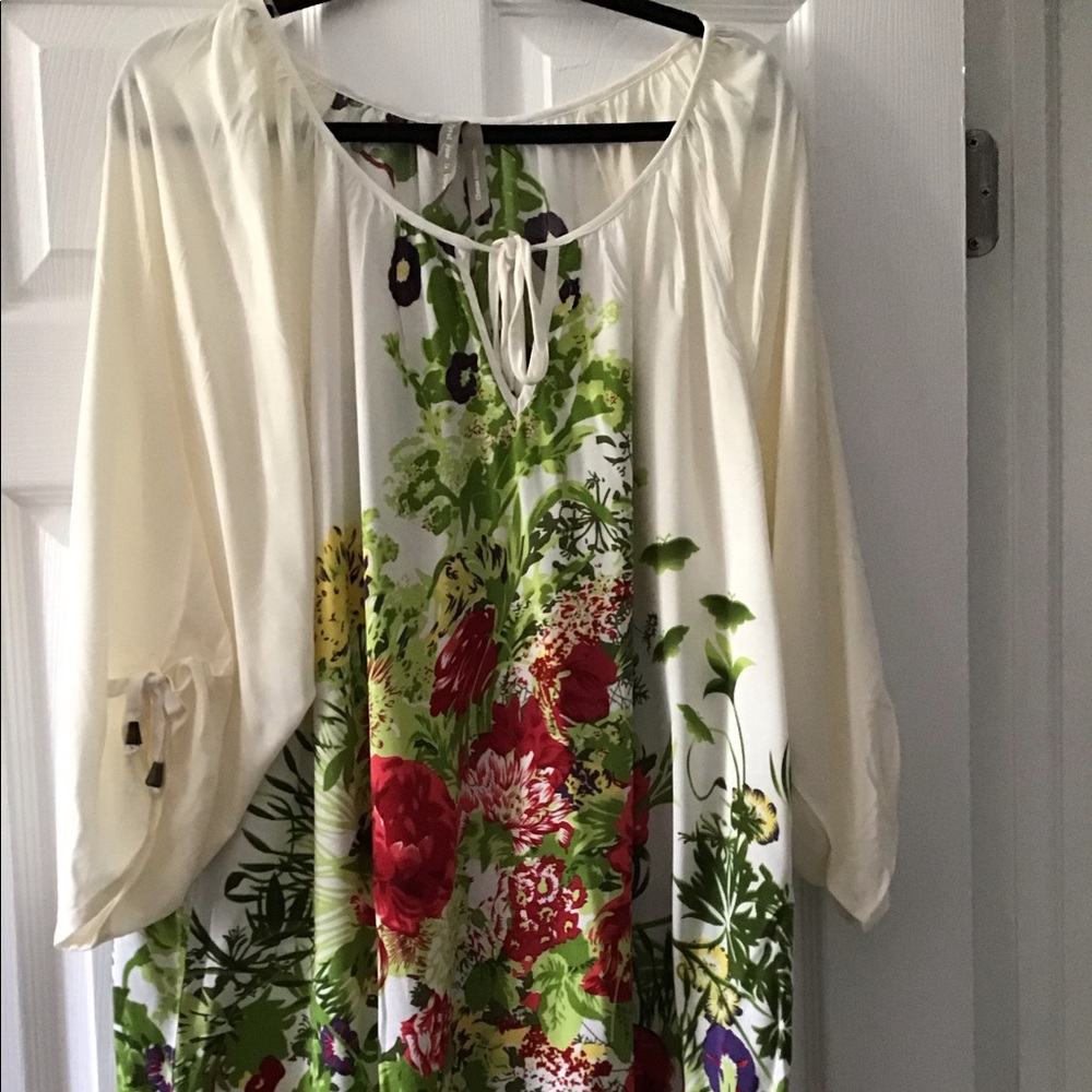Spring floral lightweight fabric top. Can we worn either for daytime or evening.